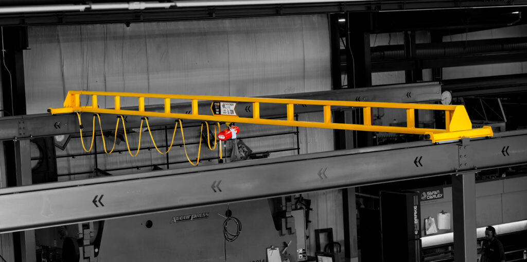 1/4 ton pwi freestanding hyperlite crane cm shopstar hoist in manufacturing setting 3