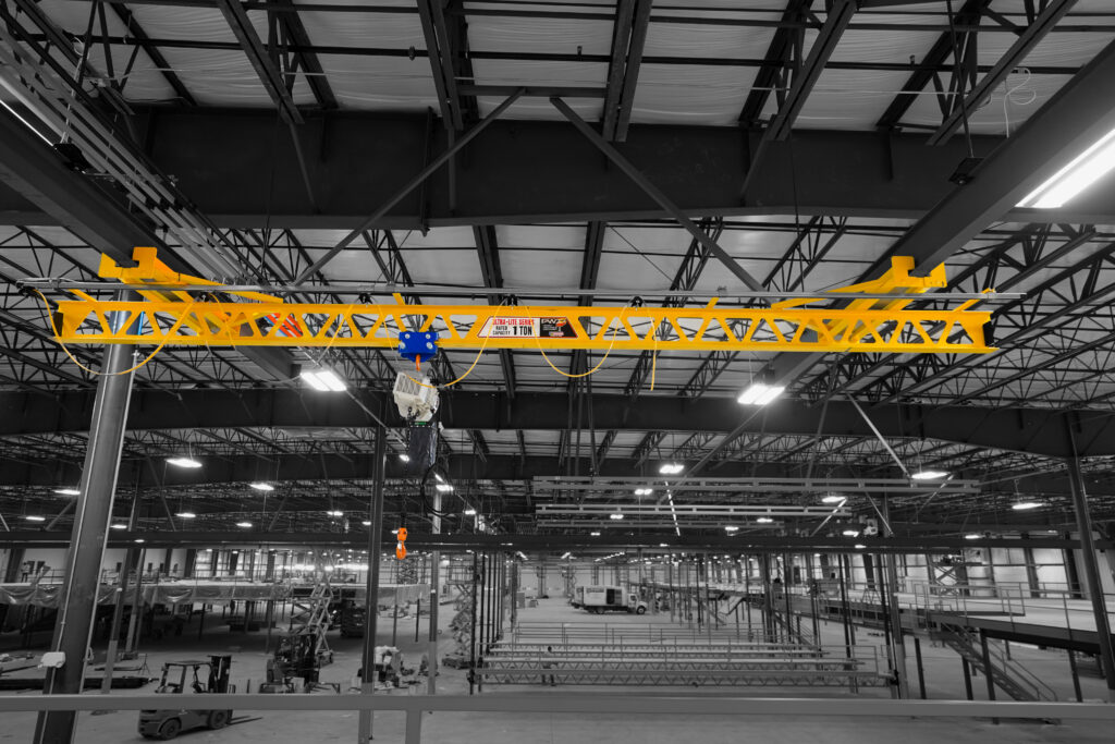 1 ton ceiling mounted ultra lite with starke stk hoist in manufacturing setting