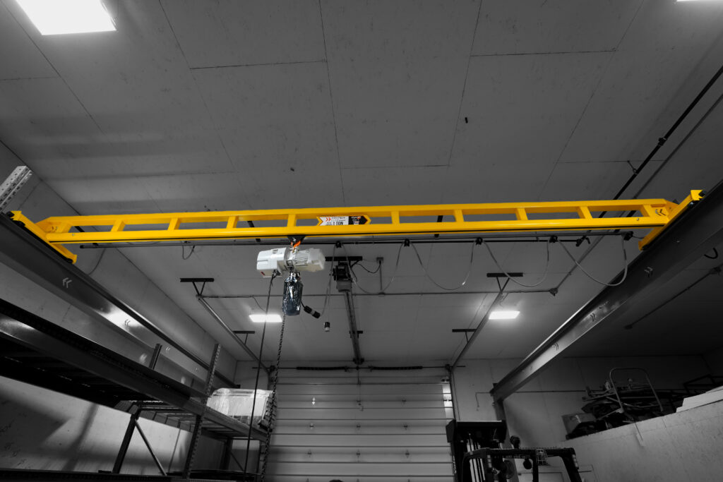 1 ton pwi freestanding hyperlite crane starke hoist with anver lifter in manufacturing setting 14