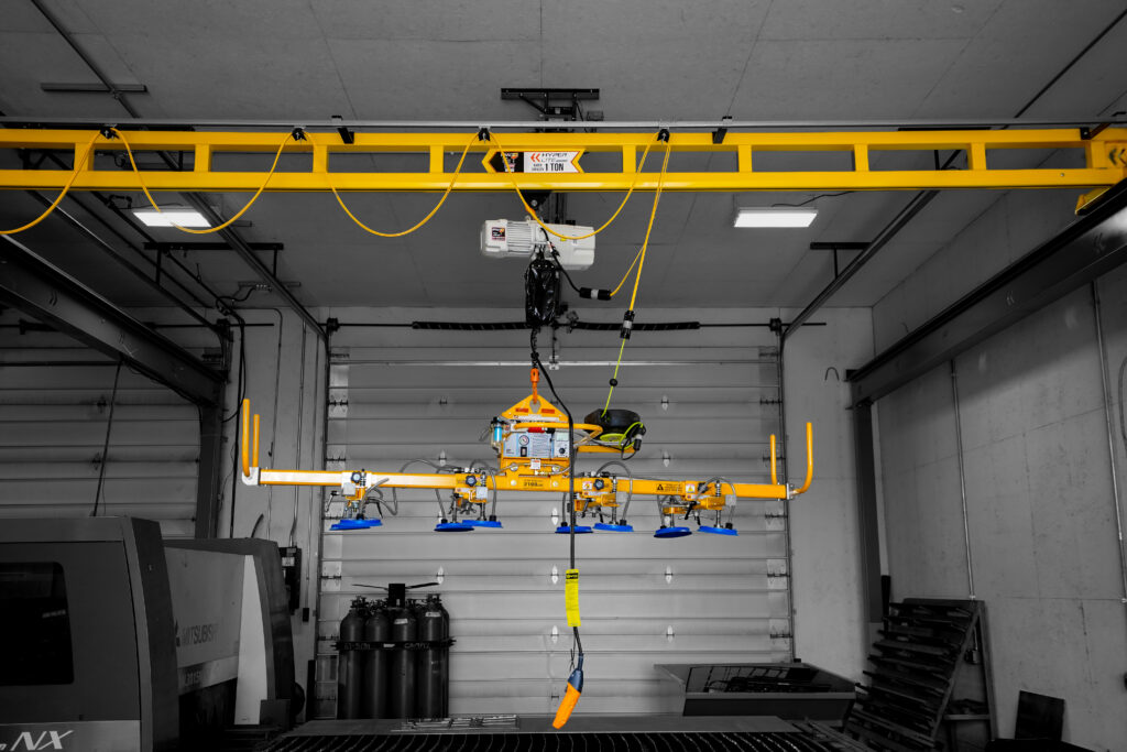 1 ton pwi freestanding hyperlite crane starke hoist with anver lifter in manufacturing setting 4