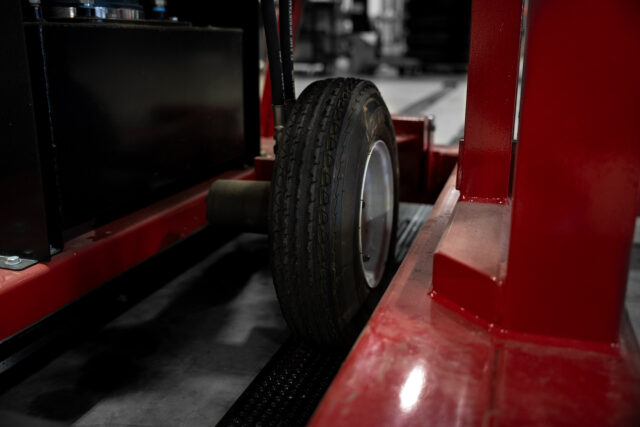 4 thousand pound capacity torque frame rotator wheel on track in manufacturing setting