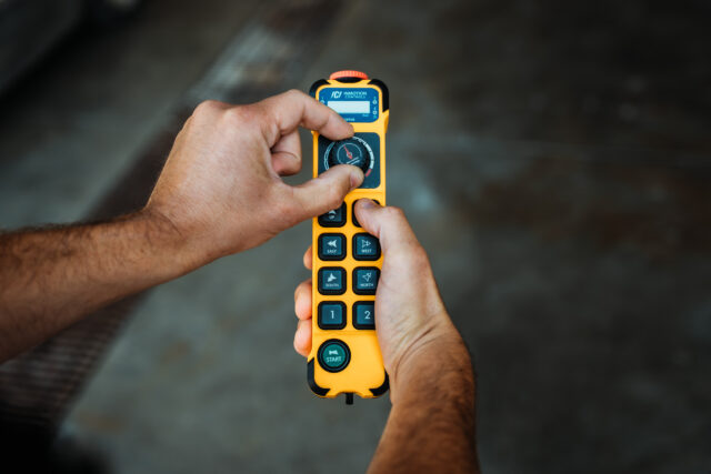 person holding and rotating inmotion controls speed dial