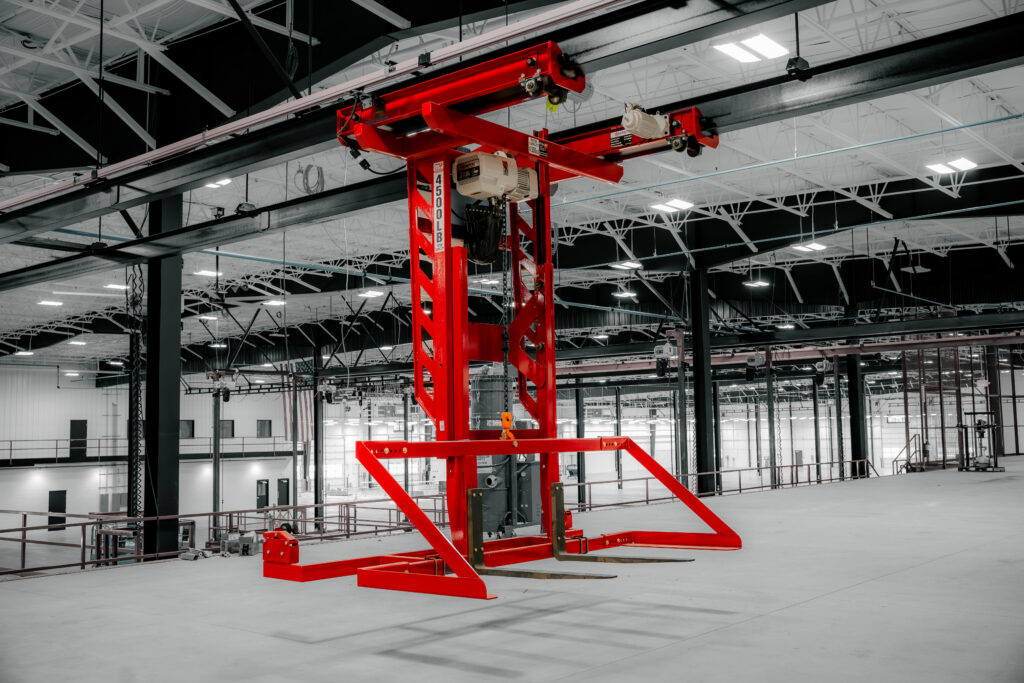 pwi decking lifter in manufacturing setting