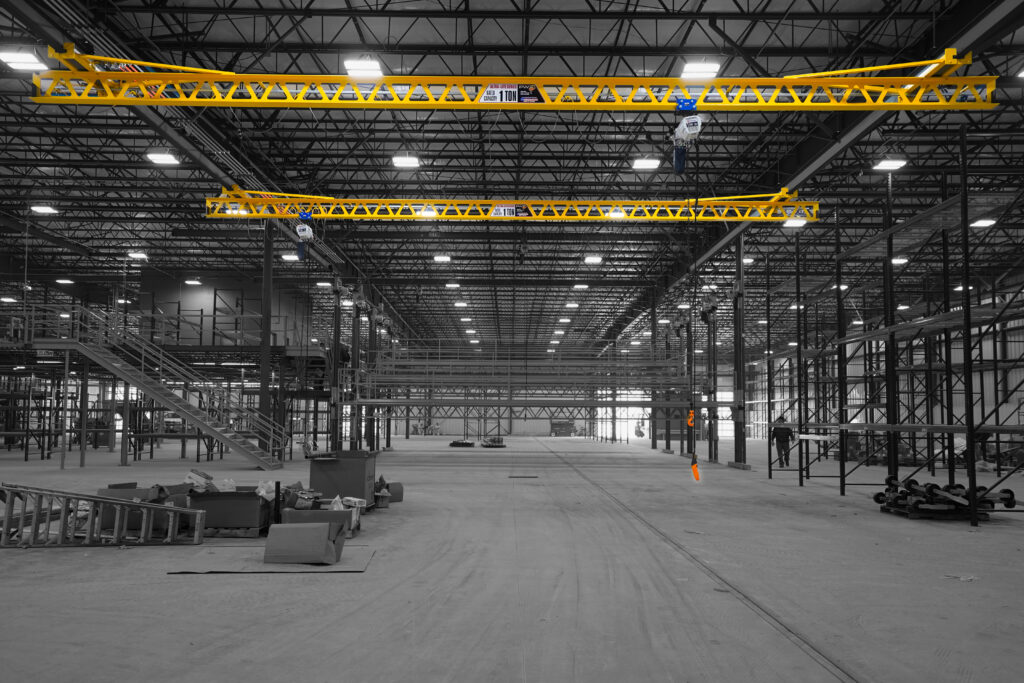 two 1 ton pwi ceiling mounted ultra lite cranes starke hoists in manufacturing setting 2